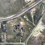 Aerial view of a rural area near Aledo, 76008, showing intersecting roads including FM 1187, open fields, scattered buildings, a pond, and patches of trees. A major highway runs diagonally across the top of the image.