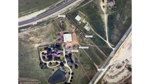 Aerial view of a rural property in Aledo, TX 76008, with a house, barn, pond, and fenced area. Measurements in feet mark boundaries along FM 1187; roads border the land dotted with trees and structures on open grassy terrain.