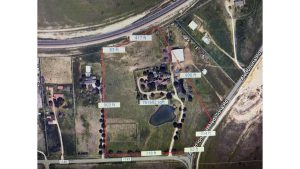 Aerial view of 2301 FM 1187, Aledo, TX 76008: a fenced property with labeled boundary lengths, pond, trees, buildings, and roads on two sides. Total area is 761,602 square feet; multiple distances are shown in feet.