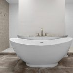 Modern bathroom with a large white freestanding bathtub, a sleek faucet, textured tile wall on the left, and neutral-toned flooring and walls.