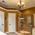 A bathroom with a glass shower and bathtub.